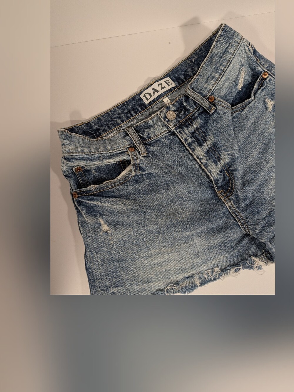 Daze Women's Light Blue Relaxed Fit Distressed Shorts